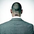rear view of a businessman with a barcode in his nape